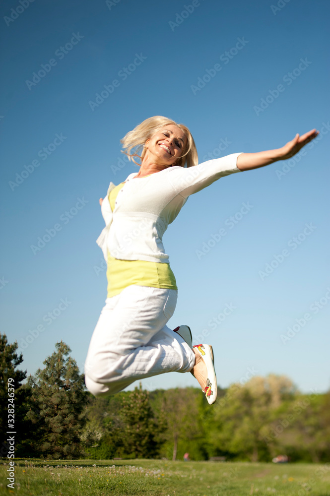 Happy senior woman in a park