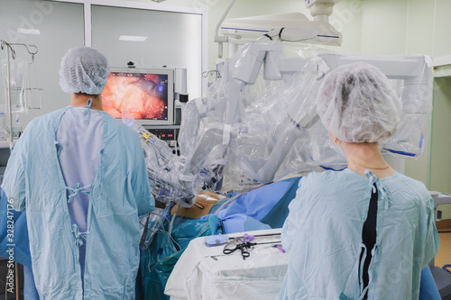 The process of carrying out a surgical operation using a modern robotic surgical system. Medical robot.