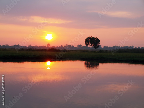 sunset over the lake © thirawat