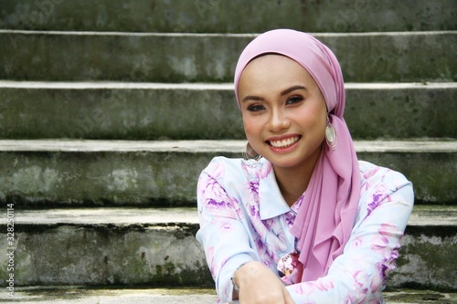 Young asian muslim girl having fun at outdoors 