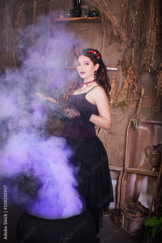 A young witch with a book in her hands cooks a potion in a large black cauldron, emitting magical purple smoke.