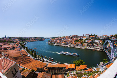 View over the city of Porto in Portugal, showing the rooftops and River Douro and The Dom Luís I Bridge