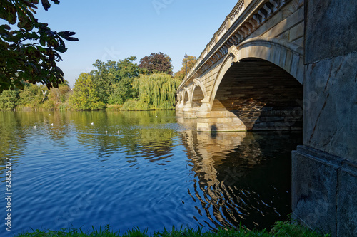 The Five arched Serpentine bridge crossing the Serpentine Lake in Hyde Park on a late Summers Afternoon. © Julian