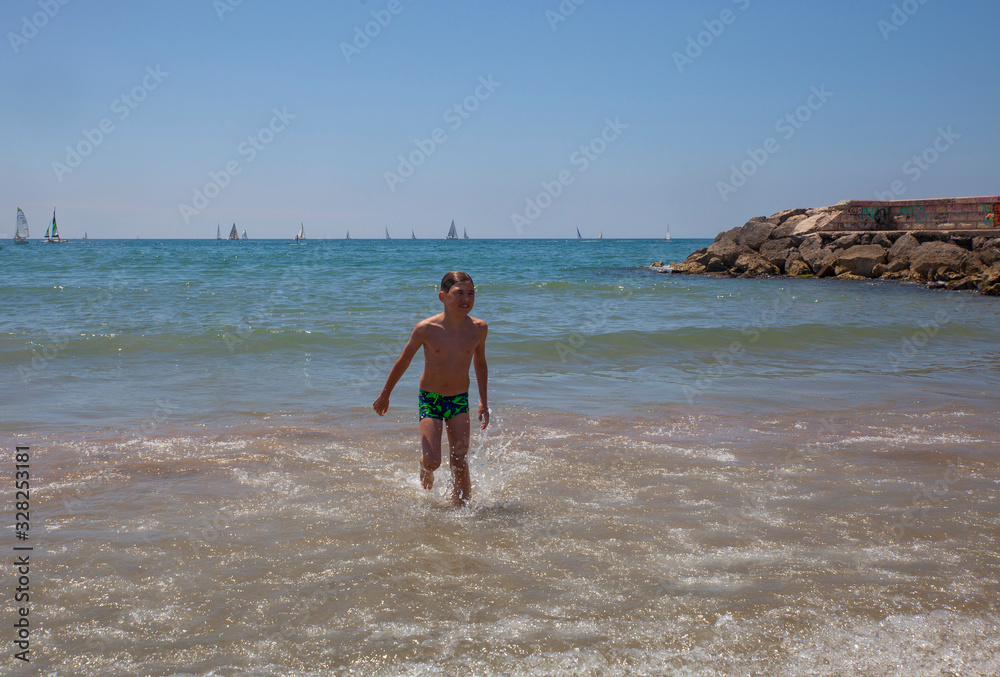Boy on the coast of the Mediterranean Sea Boy on the coast of the Mediterranean Sea