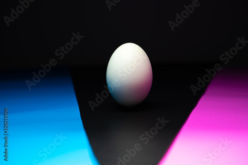 The eggs are in black, blue, pink background. Easter Egg Concept and Dark Concept