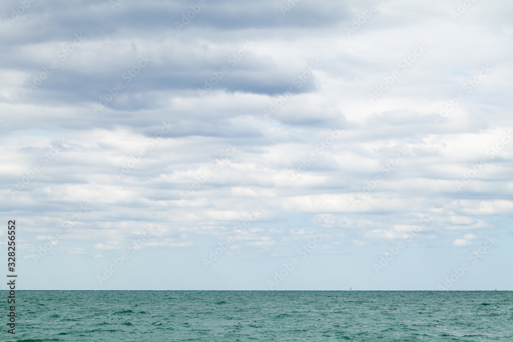 Landscape photo with white clouds and sea