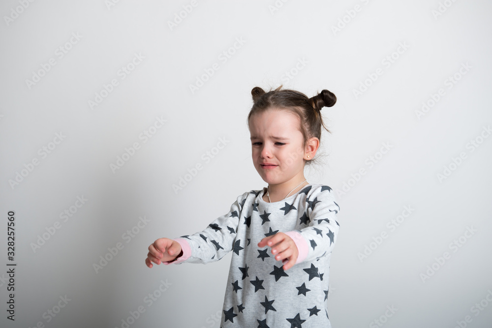 Crying little girl. Upset kid. Sad kid portrait. Cute little girl crying and does not want to go in bed at night Crying little girl. Upset kid. Sad kid portrait. Cute little girl crying and does not want to go in bed at night