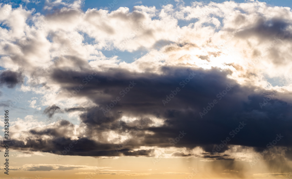 Fototapeta premium Fantastic dark thunderclouds at sunrise