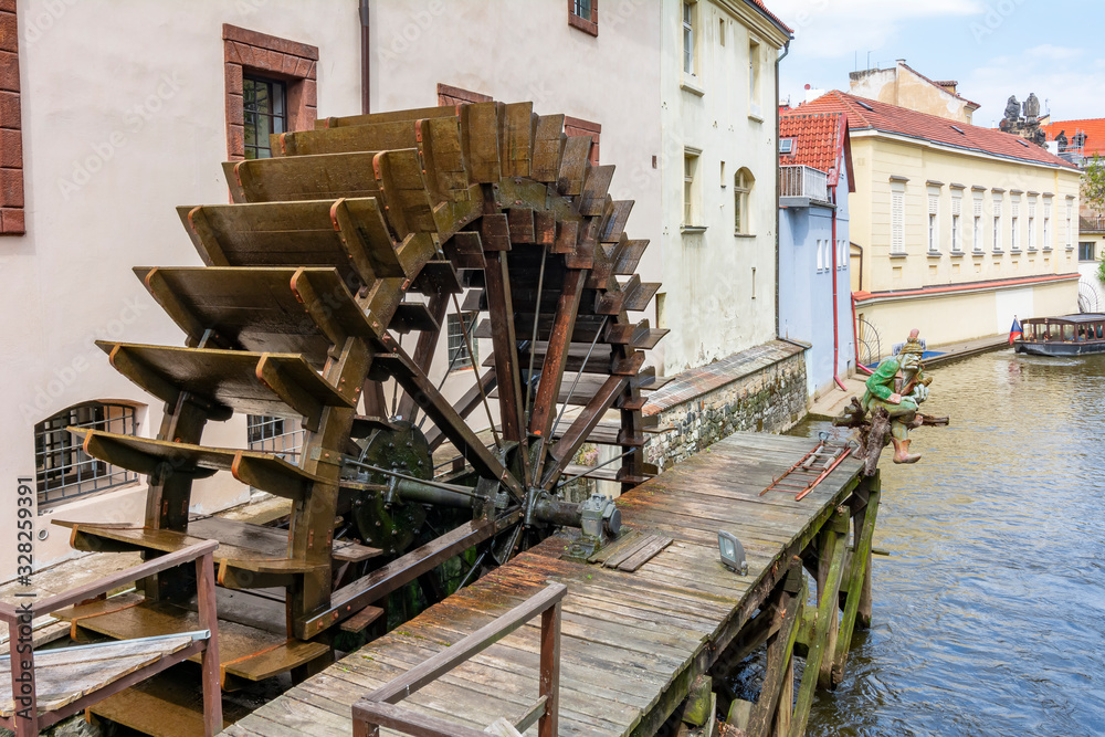 Old water wheel on Certovka river in Prague, Czech Republic Old water wheel on Certovka river in Prague, Czech Republic