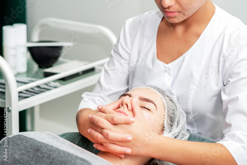 Chin massage of woman.