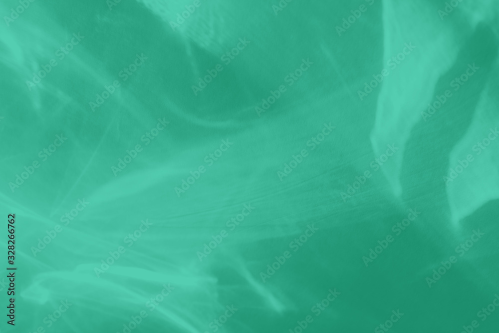 Naklejka Trendy mint colored abstract background with light and shadows caustic effect. Light passes through a glass. 2020 color trend