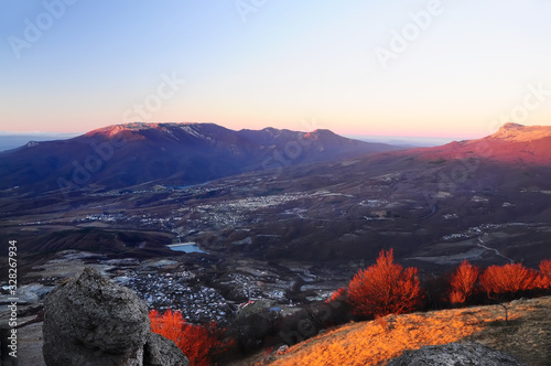 The view from the top of the mountains and the valley in the first morning rays of the sun. Wonderful mountain view.