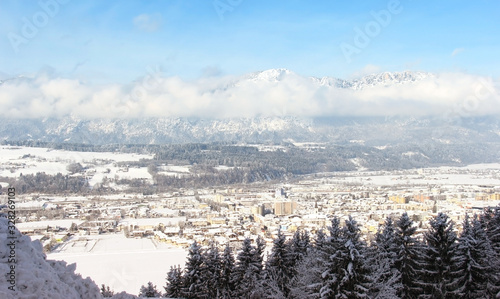 Winter panorama of the city with the background of mountains and sky