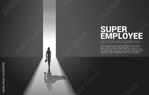 Silhouette of businesswoman and her shadow of superhero from light of exit way.concept of empower potential and human resource management