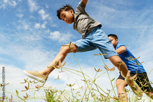 Young boy run and jump