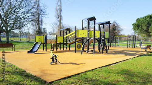 children yellow playground activities in public green park modern photo