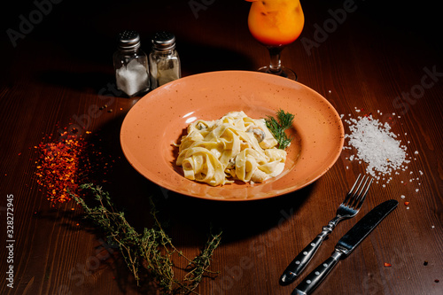 Fancy organic fetuccine pasta with creamy alfredo mushroom sauce.Top view photo