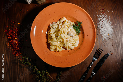 Fancy organic fetuccine pasta with creamy alfredo mushroom sauce.Top view