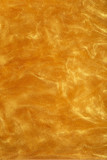 Texture of liquid shiny gold in flickering motion for the background