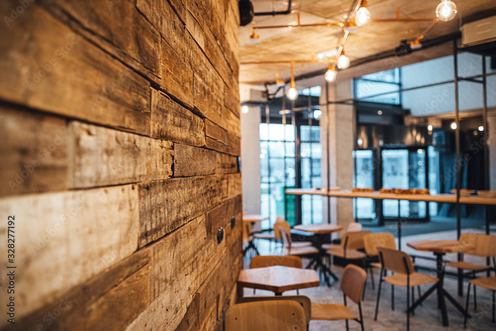 View on wooden wall and coffee shop in blurred background - obrazy, fototapety, plakaty 