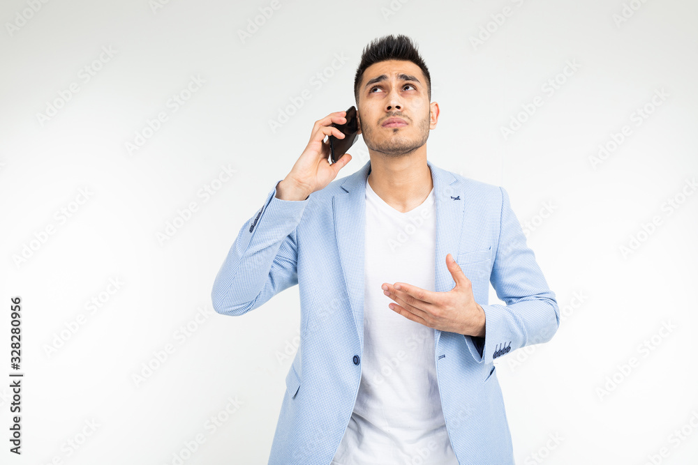 man in a blue jacket holds a phone with poor mobile connection on a white background man in a blue jacket holds a phone with poor mobile connection on a white background
