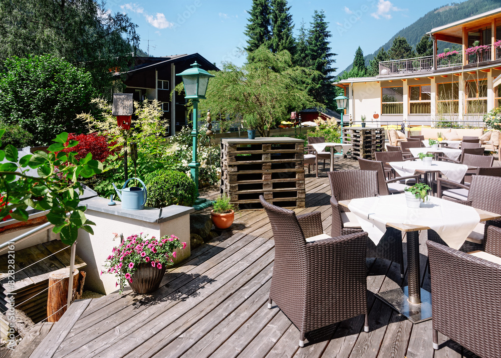 Fototapeta Street restaurant with table and chairs in Bad Kleinkirchheim Austria