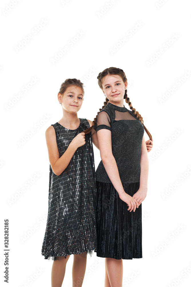 two girlfriends. portrait of girls in the studio. fashion shooting of children. two girlfriends. portrait of girls in the studio. fashion shooting of children.