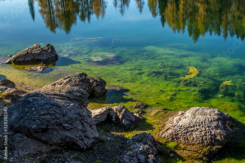 Rocks with green water of mountain lake at Seven lakes valley  Bohinj