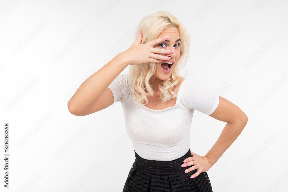 girl flirts building eyes on white background with copy space girl flirts building eyes on white background with copy space