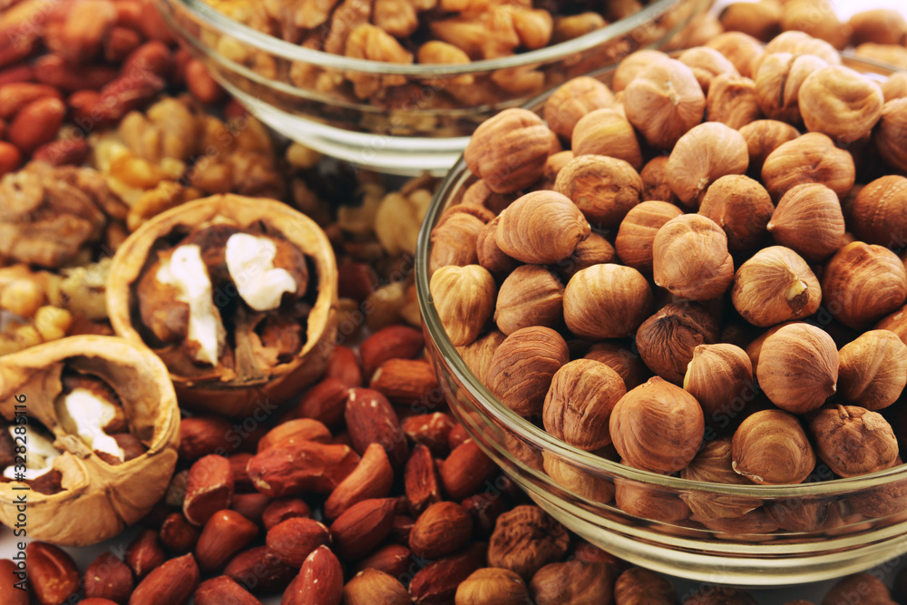 Different nuts in glass cups Different nuts in glass cups