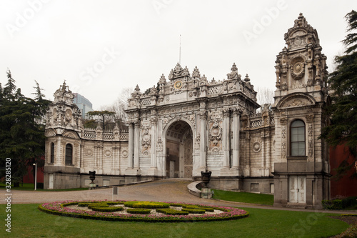 Magnifient ornamental gate on Dolmabahce palace in a rainy day