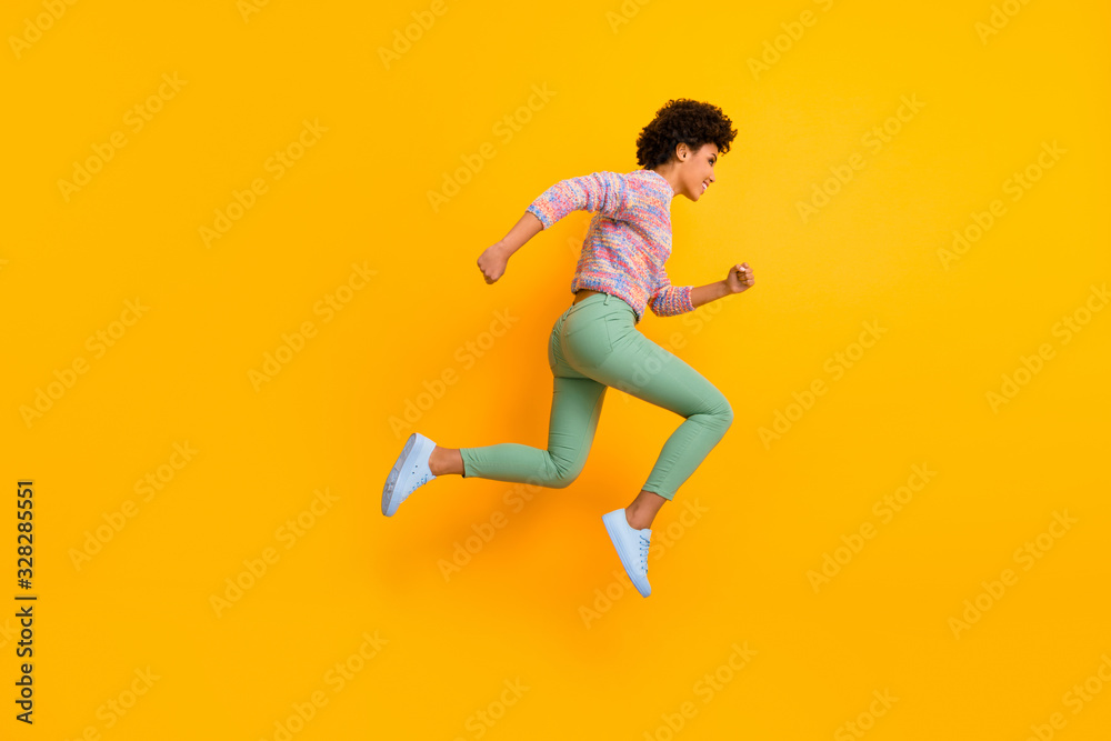 Dont waste time hurry discount. Full size profile side photo of cheerful crazy funny afro american girl jump run wear green colorful fall autumn sweater isolated bright color background