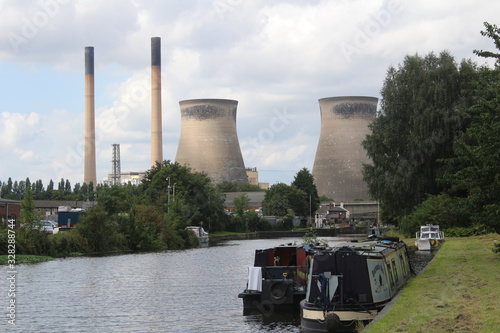 Narrow boats on canal with Ferrybridge Power Station in background Aire and Calder navigation Knottingley West Yorkshire Britain,UK photo