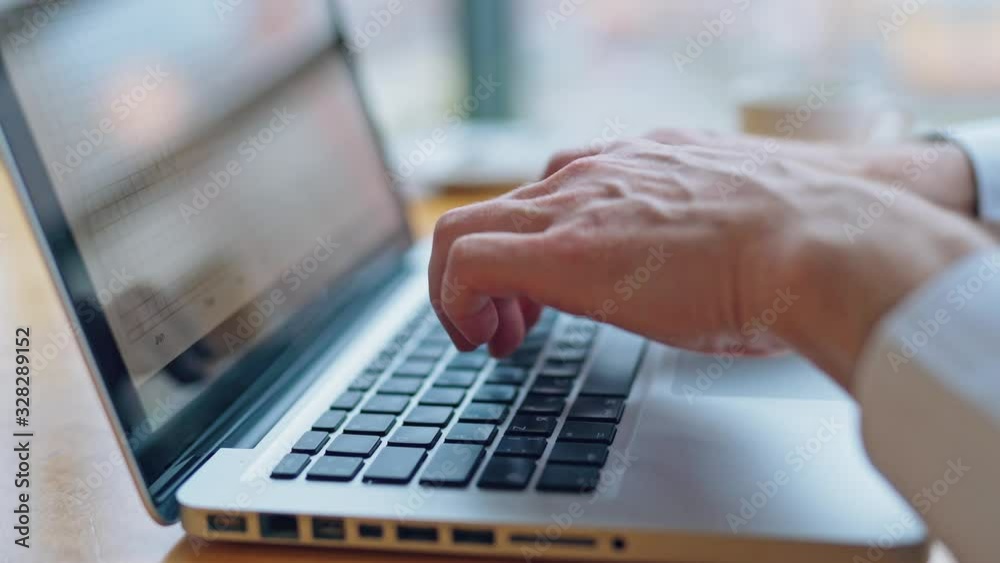 Image of man's hands typing on laptop. Selective focus. Business concept video.