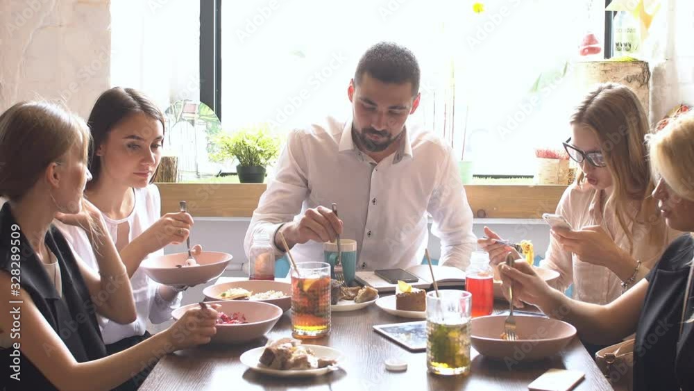 Group of Multi ethnic people talking about work while they eating. Group of Multi ethnic people talking about work while they eating.