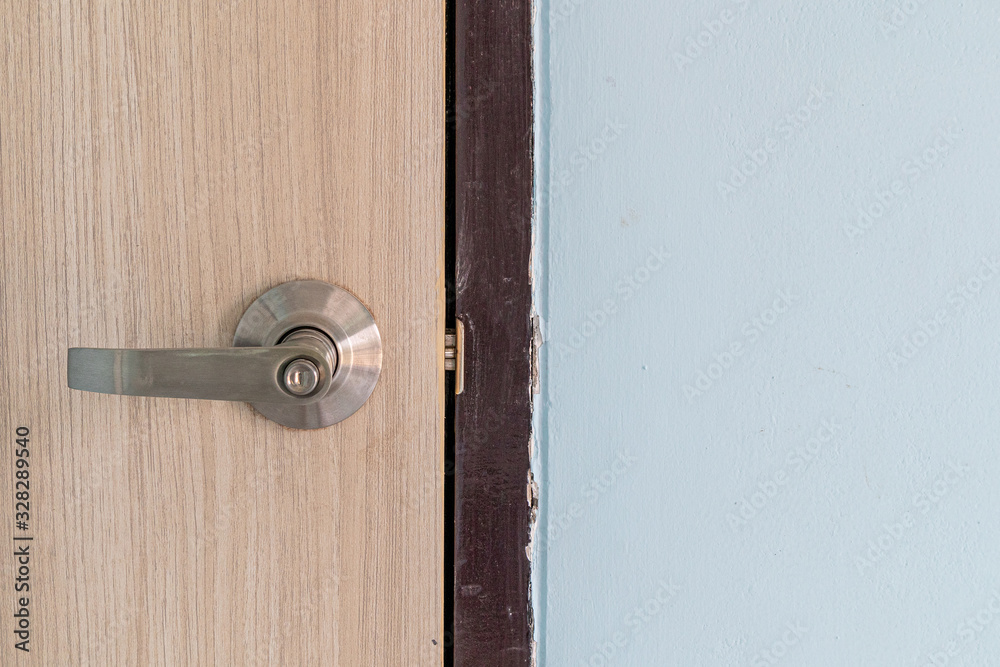 Metal door handles on modern wooden doors. Metal door handles on modern wooden doors.