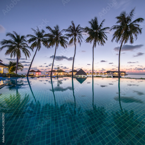Beautiful outdoor infinity pool at a luxury beach resort © eyetronic