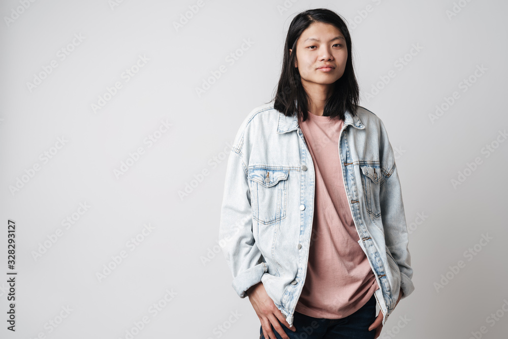 Image of handsome asian man posing and looking at camera