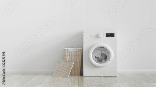 Modern washing machine, laundry in baskets and domestic emty room interior. White wall. photo