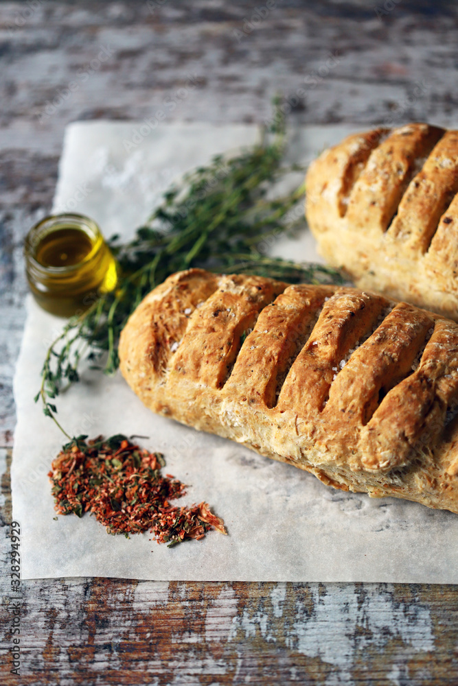Homemade bread with Italian herbs and spices. Italian food. Homemade bread with Italian herbs and spices. Italian food.