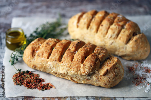 Homemade bread with Italian herbs and spices. Italian food.