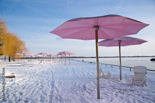 Toronto, Ontario / Canada - Mar 01, 2019 : Beach chairs, snow and umbrellas © Elton
