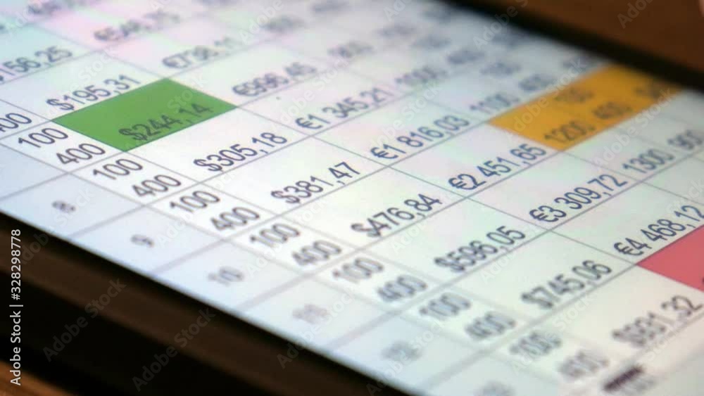 The hand (finger) work with phone touchscreen. Working with financial, economic tables. Concept. Table, finance, currency. Close up macro view. The hand (finger) work with phone touchscreen. Working with financial, economic tables. Concept. Table, finance, currency. Close up macro view.