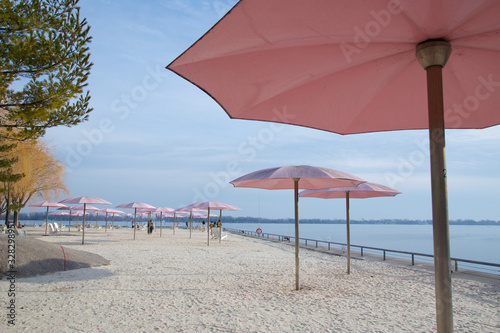 Photography Toronto, Ontario / Canada - Feb 24, 2020 : Beach chairs with umbrella in sunny d