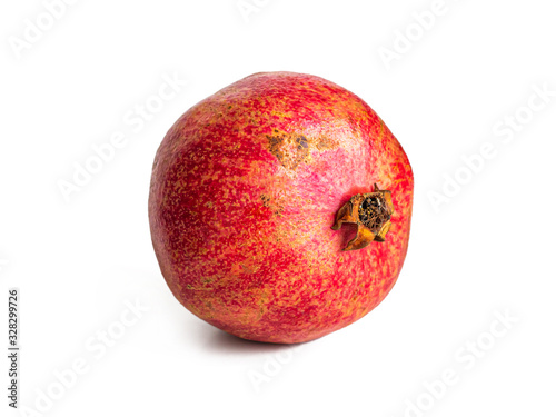 Ripe pomegranate on a white background