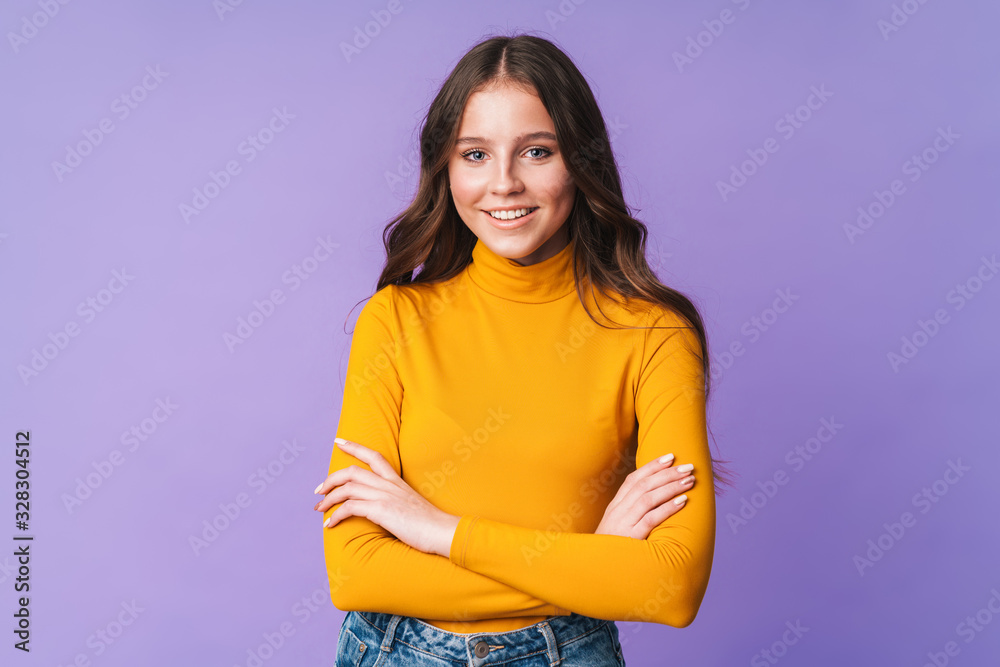 Image of young beautiful woman with long brown hair smiling at camera Image of young beautiful woman with long brown hair smiling at camera