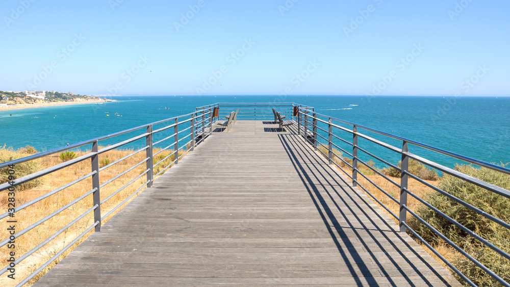 Benches on the terrace at the ocean in Albufeira