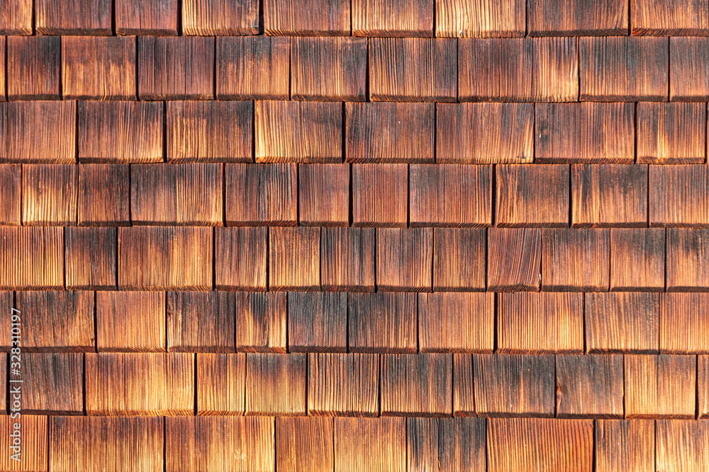Facade covered with wooden weathered shingles. Facade covered with wooden weathered shingles.