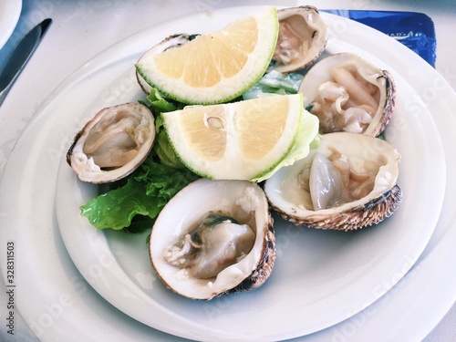 oysters with lemon on a plate