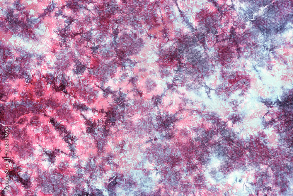 tie dye pattern hand dyed on cotton fabric abstract texture background. tie dye pattern hand dyed on cotton fabric abstract texture background.